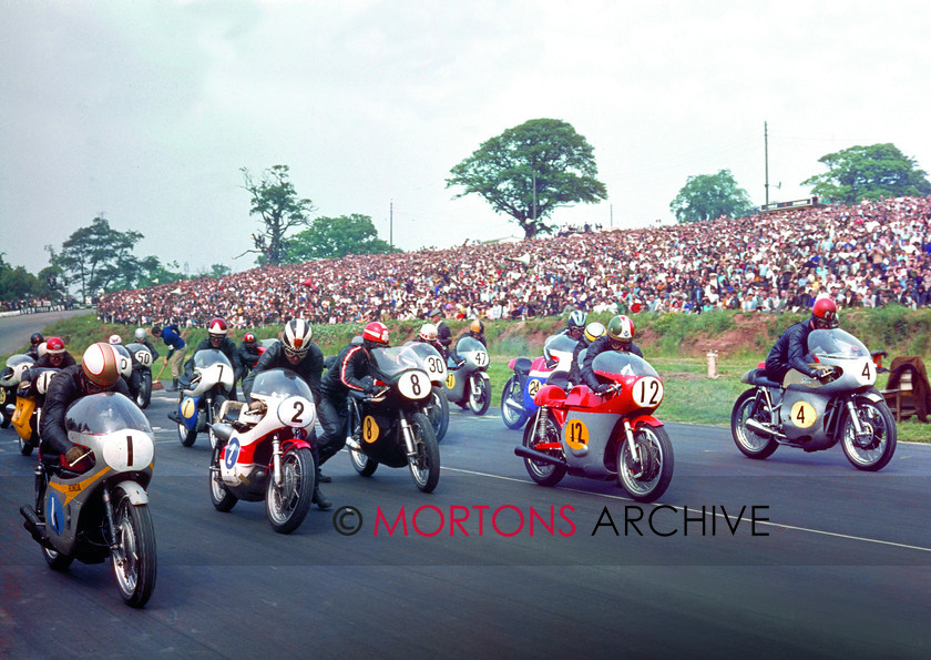 Post TT 1968 Mallory 
 What a picture... taken at the Post TT in1968. Front row, from left Mike Hailwood (Honda), Phil Read (Yamaha), Rod Gould (Norton), Giacomo Agostini (MV) and John Cooper (Seeley). Also the star studded grid are 19 Pat Mahoney, 7 Percy Tait, 50 Percy May, 30 Barry Randle, 47 Brian Ball, 24 Rex Butcher and partially hidden behind 'Ago', Ray Pickrell. 
 Keywords: Mallory Park, Mortons Archive, Mortons Media Group Ltd, Nick Nicholls