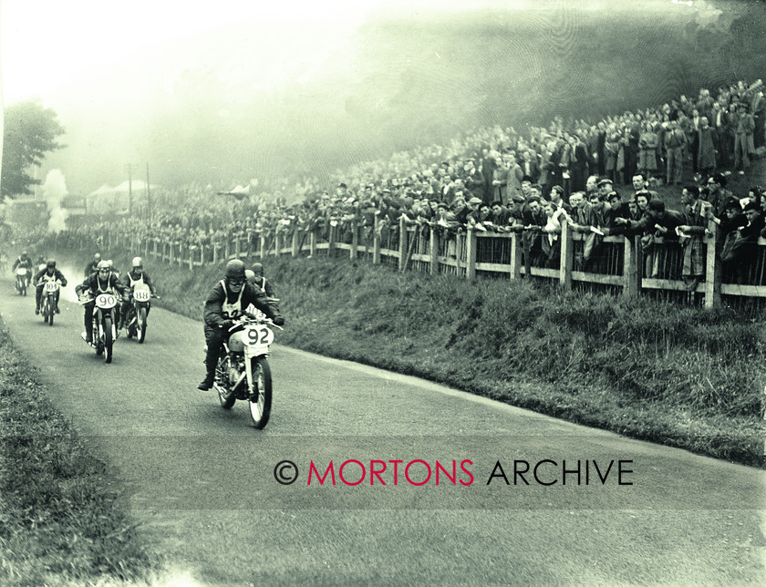 062-SFTP-C25670 
 Johnny Hodgkin, aboard the prototype HRD (Vincent) Grey FLash, heads the field. 
 Keywords: 1949, May, Mortons Archive, Mortons Media Group, Oliver's Mount, Scarborough, Straight from the plate, The Classic MotorCycle