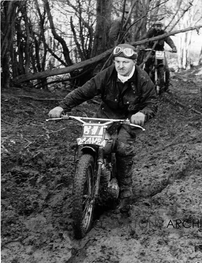 NNC-T-A-37 
 NNC T A 037 - John Avery on a 199cc Triumph in the Victory Trial where he lost 10 marks and won a first class award beating many of the factory riders of the day. 
 Keywords: Mortons Archive, Mortons Media Group Ltd, Nick Nicholls, Trials