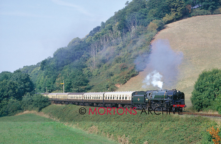 WD594787@64 preservation 01 
 The National Collection's BR Standard 9F 2-10-0 No 9220 Evening Star passees Castle Hill, West Somerset Railway on 7th September 1987, shortly before expiry of its boiler certificate. 
 Keywords: Heritage Railway, Mortons Archive, Mortons Media Group