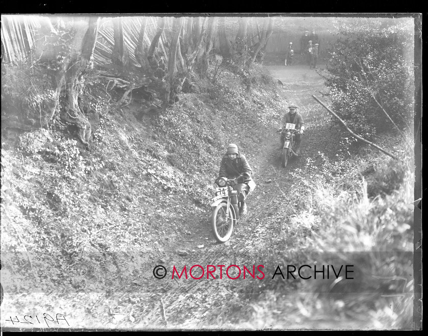 062 SFTP A9124 
 One of the lady riders, Elizabeth Sturt, keeps her 500cc Scott ahead of P J Dyster's Montgomery. 
 Keywords: 1928, 2012, Mortons Archive, Mortons Media Group, September, Southern Trial, Straight from the plate, The Classic MotorCycle